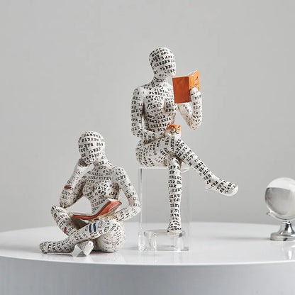 Modern women reading resin sculpture